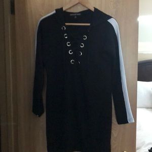 Hooded sweater black with white strips on sleeves.